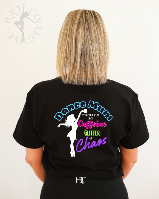 Person wearing a black t-shirt with a colorful graphic and text on the back.